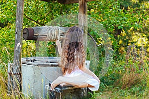 Emotional portrait of a little girl with long hair, summer day