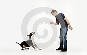 Emotional Portrait of a man and his Bull Terrier dog, concept of friendship and care of man and animal