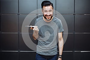 Emotional portrait of a stylish guy`s guy, hipster, dressed in a