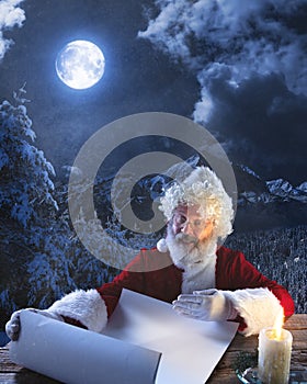 Emotional Santa Claus congratulating with New Year and Christmas, writing a letter, wish list in midnight with candle