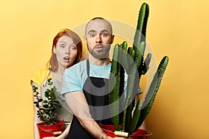 Emotional scared man and woman with surprised faces