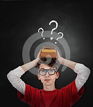 Emotional screaming pupil boy near chalkboard