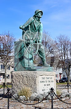 Emotional statue of Fisherman standing at the helm of ship, honoring sailors lost at sea, Fishermen`s Memorial, Gloucester,2018s,