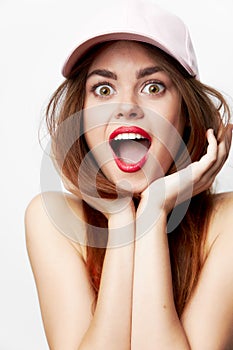 Emotional woman in a cap A surprised look with an open mouth model