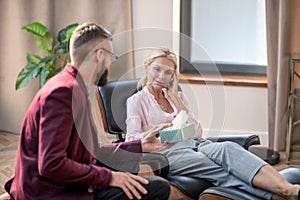 Emotional woman crying while sharing memories about husband