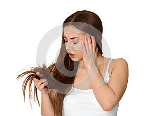 Emotional woman with damaged hair on white background.