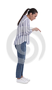 Emotional woman pointing with index finger on white background