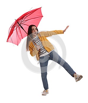 Emotional woman with umbrella caught in gust of wind on white background