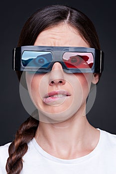 Emotional young woman in 3d glasses
