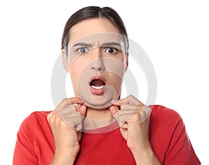 Emotional young woman with double chin on background