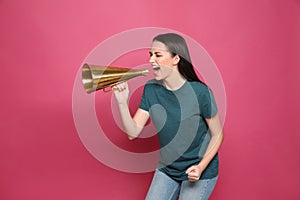 Emotional young woman with megaphone