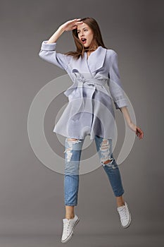 Emotional Young Woman in Outer Garments photo