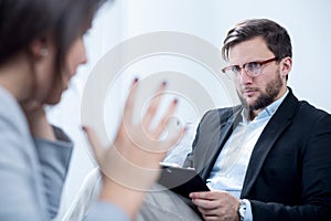 Emotionally unstable woman during psychotherapy photo