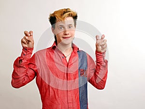 Emotioned guy with golden hairstyle in the red