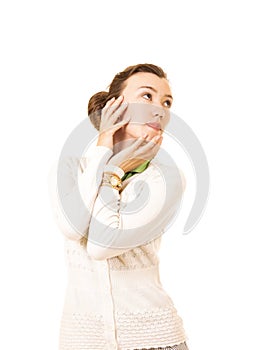 Emotions of a beautiful girl with long hair, in a white jacket.