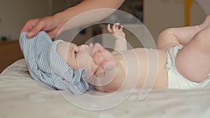 Emotions of joy. Playing with a newborn baby while dressing up.