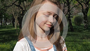 Emotions of a teenage girl. The girl`s face is close-up. A beautiful face with freckles.