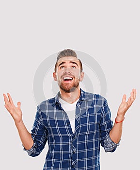 Emotions. Young man in blue shirt