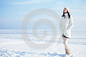 Emotive portrait of fashionable model in white coat and beret