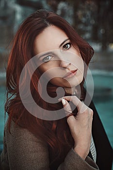 Emotive portrait of red haired woman