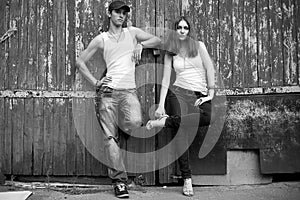 Emotive portrait of a stylish couple in jeans standing together