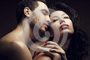 Emotive portrait of two lovers - handsome man and gorgeous woman