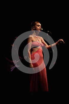 Emotive On-Stage Portrait of a Young Blond Singer