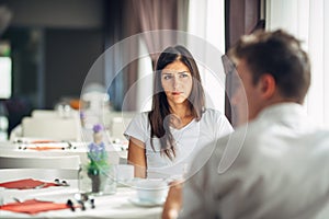 Empathetic emotional woman listening about bad news,problems.Sad woman feeling absent and not interested.Doubting fidelity