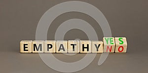 Empathy yes or no symbol. Concept words Empathy no to Empathy yes on beautiful wooden cubes. Beautiful grey table grey background