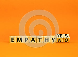 Empathy yes or no symbol. Concept words Empathy no to Empathy yes on beautiful wooden cubes. Beautiful orange table orange