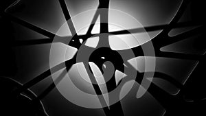 Emphasizes the interplay between light and dark creating a visually