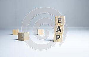 Employee assistance program EAP sign on wooden cubes