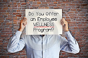 Employee benefits concept with young businessman asking â€œdo you offer an employee wellness program?â€