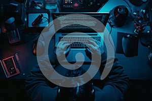 An employee, a coder, or a developer working late on a computer display in problem solving at night on the network