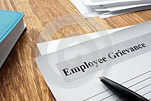 Employee Grievance form on an office desk