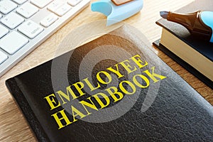 Employee handbook on a desk.