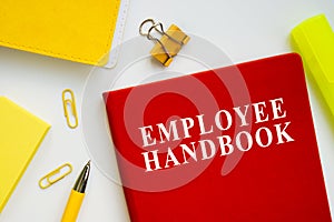 Employee handbook guide on the office desk.