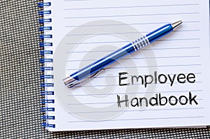 Employee handbook text concept on notebook