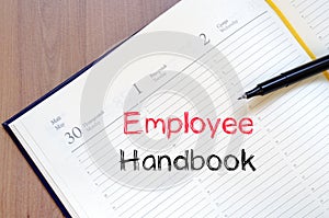 Employee handbook text concept on notebook