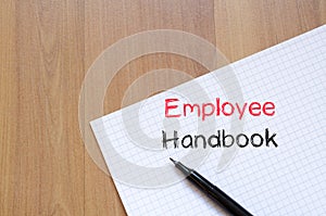 Employee handbook text concept on notebook