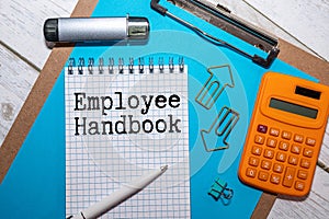 Employee Handbook text written in Notepad.