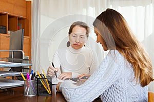 Employee interviewing young woman