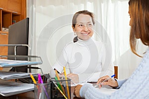 Employee interviewing young woman