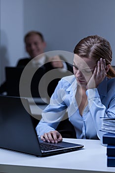 Employee laughing at her associate