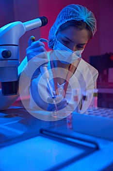 Employee of a modern cryo-laboratory works with biomaterial