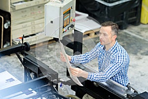 Employee printing company at work