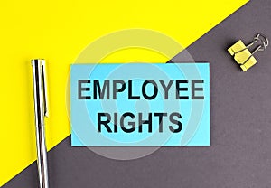 EMPLOYEE RIGHTS text written on sticky with pen on grey, yellow background, business concept