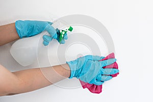Employee`s hands were wiping the white walls, use a towel moistened with cleaning solution to rub the wall, Text fill area, White