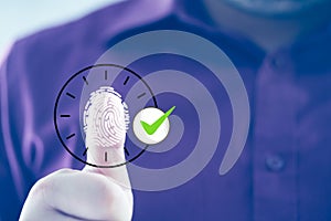 Employee scanning fingerprint record hours work time. Employee attendance concept