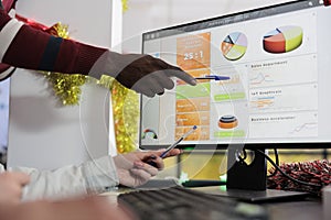 Employee showing data on computer screen